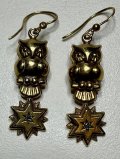 星をつかんだフクロウのゴールドピアス1920年イギリス